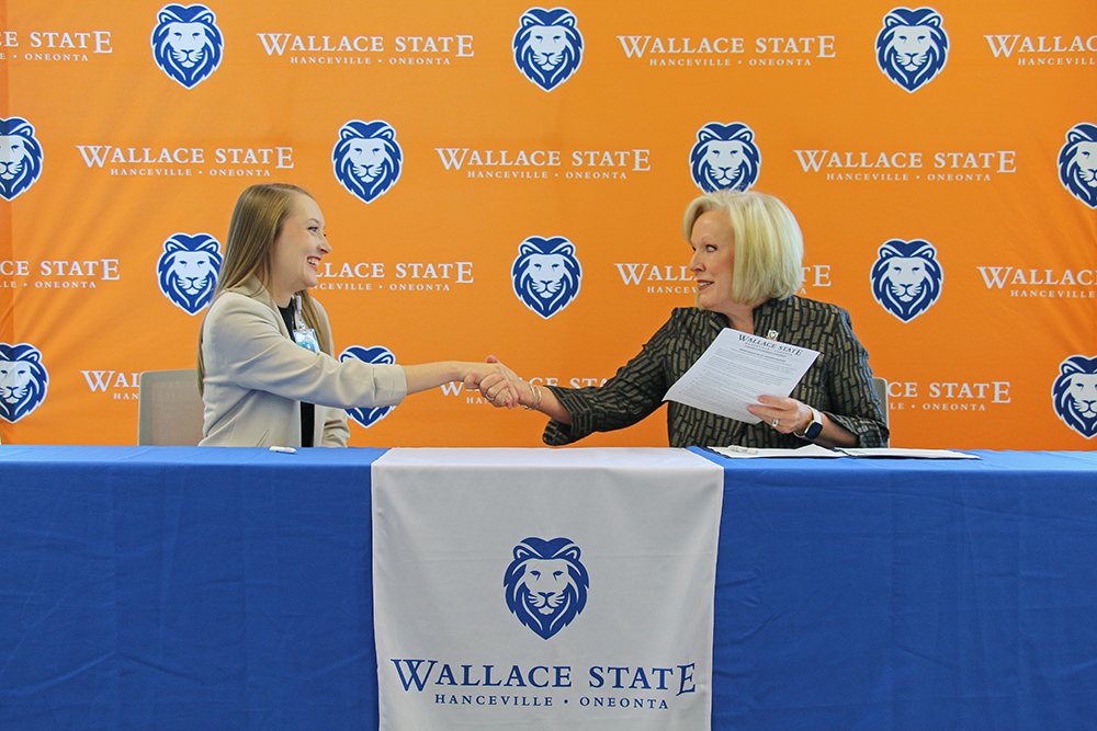 Jessica McClendon of Marshall Medical Centers shakes hands with Wallace State President Dr. Vicki Karolewics after signing the Powerful Partnerships Agreement. Jessica McClendon of Marshall Medical Centers shakes hands with Wallace State President Dr. Vicki Karolewics after signing the Powerful Partnerships Agreement.